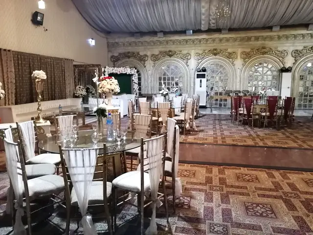Round glass dining tables with covered chairs