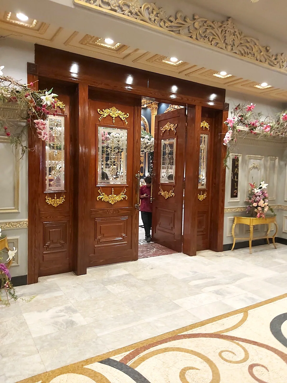 Carved wooden doors at the hall entrance