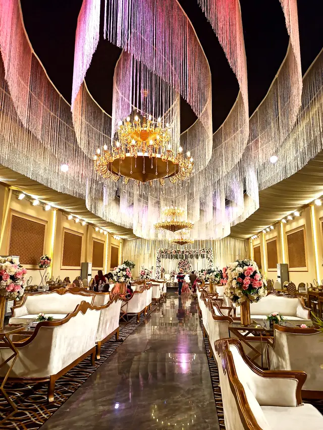 Main hall with crystal chandeliers and lounge seating